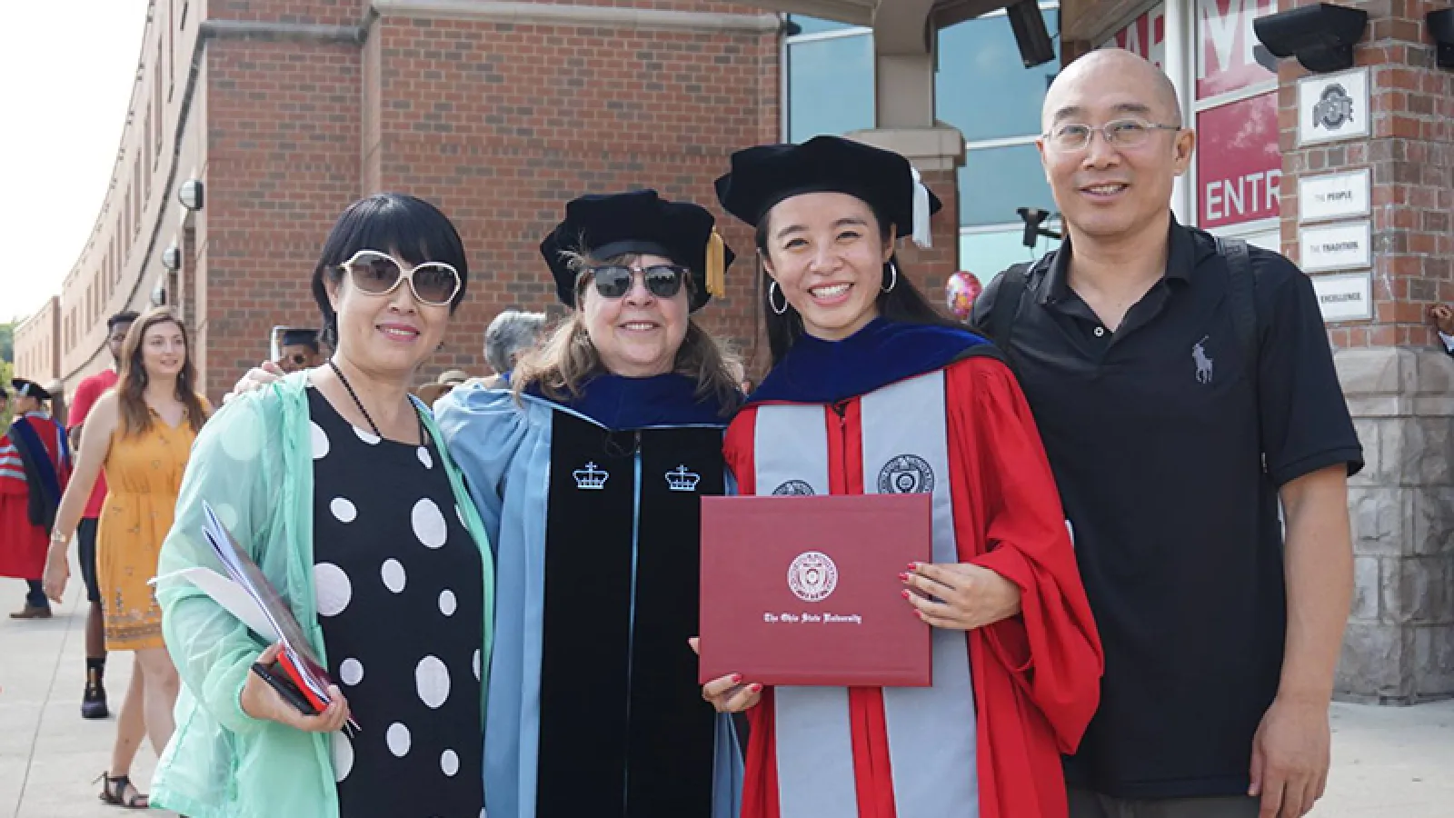 Graduate student and her family at graduation