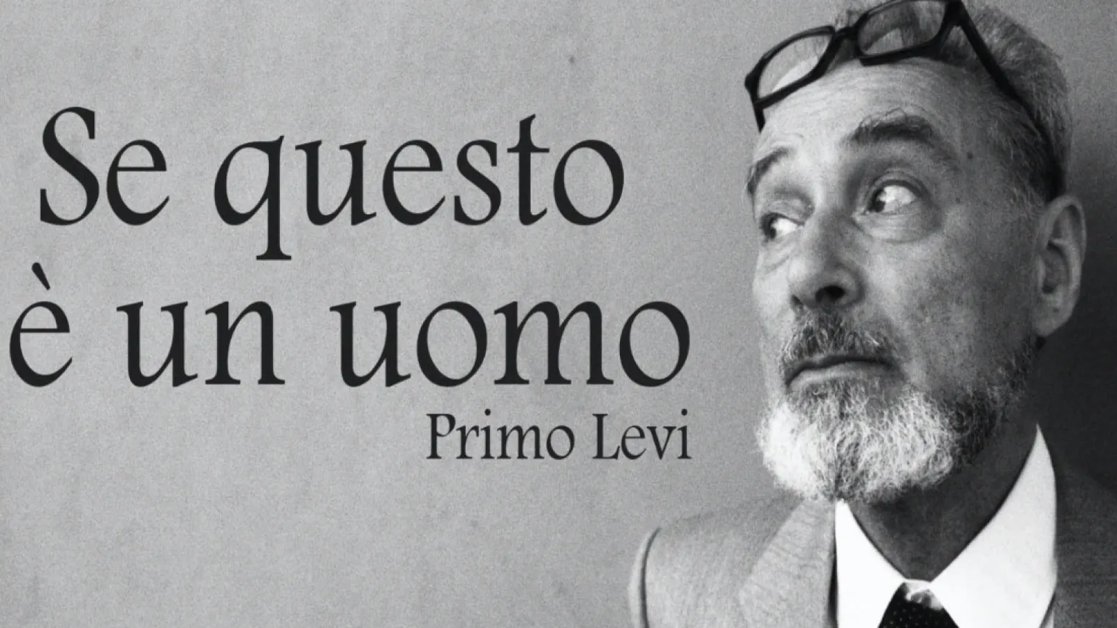 A man wearing glasses next to the text "Se questo è un uomo, black and white