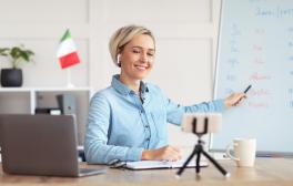 Woman teaching an Italian class to online students.