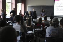 Students listen to faculty introductions at the Welcome Party