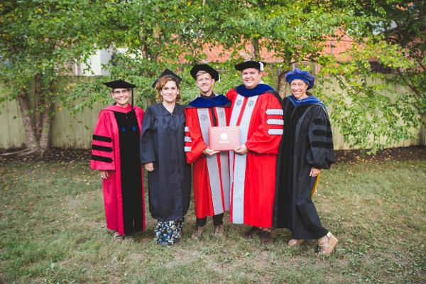 Renga (right) marking the graduation of FRIT's PhD students