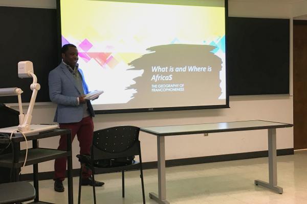 Eric Tsimi presenting during the 1st Annual Francophone Day